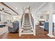 Spacious home foyer with staircase, hardwood floors, open floor plan, and natural light at 306 Long Pier St, Summerville, SC 29486