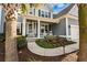 Inviting front porch with rocking chairs, a 'Welcome' sign, and a beautifully decorated door at 306 Long Pier St, Summerville, SC 29486