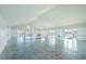 The clubhouse interior with concrete floors, white walls and trim, and bright sunlight at 306 Long Pier St, Summerville, SC 29486