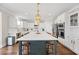 Expansive kitchen featuring a large center island with seating, modern lighting, and stainless appliances at 306 Long Pier St, Summerville, SC 29486