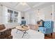 Open-concept living room boasts hardwood floors, coffered ceilings, and abundant natural light at 306 Long Pier St, Summerville, SC 29486