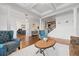 Bright living room with hardwood floors, stylish seating, and open access to other living areas at 306 Long Pier St, Summerville, SC 29486