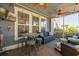 Cozy screened porch with bar table and stools and comfortable seating area at 306 Long Pier St, Summerville, SC 29486