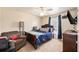 Cozy bedroom features soft lighting, a comfortable chair, and classic decor creating a relaxing atmosphere at 3075 Old Highway 52, Moncks Corner, SC 29461