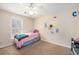 Bright bedroom with a ceiling fan, natural light, and cozy decor creating a comfortable and inviting space at 3075 Old Highway 52, Moncks Corner, SC 29461