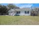 Traditional single-story home with black shutters and a cozy front porch at 3075 Old Highway 52, Moncks Corner, SC 29461