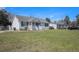 Inviting single-story home with a covered porch and large grassy front yard at 3075 Old Highway 52, Moncks Corner, SC 29461
