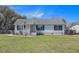 Charming single-story home with black shutters and a well-maintained front yard at 3075 Old Highway 52, Moncks Corner, SC 29461