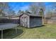 Backyard shed surrounded by a trampoline and fenced perimeter at 3075 Old Highway 52, Moncks Corner, SC 29461