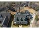 Aerial view of a beautiful home with lush landscaping, a detached garage, and a charming backyard at 318 Archibald Dr, Goose Creek, SC 29445