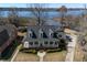Inviting waterfront home with a charming front porch and well-manicured landscaping at 318 Archibald Dr, Goose Creek, SC 29445
