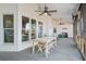 Relaxing back porch featuring an outdoor table/bench, a ceiling fan and backyard views at 318 Archibald Dr, Goose Creek, SC 29445