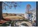 Picturesque backyard with lush lawn, waterfront views, mature trees, and shed at 318 Archibald Dr, Goose Creek, SC 29445