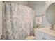 Cozy bathroom with floral shower curtain, white vanity, and neutral wall color at 318 Archibald Dr, Goose Creek, SC 29445