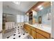 Bright bathroom with double vanity, soaking tub, and shower, complemented by tile flooring and ample natural light at 318 Archibald Dr, Goose Creek, SC 29445