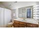 Bright bathroom with vanity, shower curtain, and Hollywood-style mirror lighting at 318 Archibald Dr, Goose Creek, SC 29445