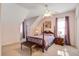 Bedroom with a four-poster bed, plush carpet, and natural light from the window at 318 Archibald Dr, Goose Creek, SC 29445