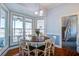 Cozy breakfast nook featuring a round table, chandelier, and lots of natural light at 318 Archibald Dr, Goose Creek, SC 29445