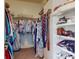 Walk-in closet with custom shelving and hanging racks for optimal organization and storage solutions at 318 Archibald Dr, Goose Creek, SC 29445