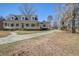 Charming home with a spacious front porch, manicured landscaping, and a winding driveway at 318 Archibald Dr, Goose Creek, SC 29445