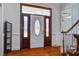 Elegant foyer featuring hardwood floors, a decorative front door with sidelights, and classic trim at 318 Archibald Dr, Goose Creek, SC 29445