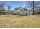 Spacious three-car garage with a second story porch and an adjacent storage shed at 318 Archibald Dr, Goose Creek, SC 29445