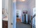 Hallway with half bath and entryway with stainless steel refrigerator and stair access at 318 Archibald Dr, Goose Creek, SC 29445