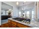 Open concept kitchen with stainless steel gas cooktop and views of the breakfast nook and living room at 318 Archibald Dr, Goose Creek, SC 29445