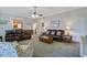 Cozy living room with plush seating, fireplace, and large windows providing natural light and views at 318 Archibald Dr, Goose Creek, SC 29445