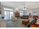 Inviting living room boasts a fireplace, French doors, plush seating, and an open layout for gatherings at 318 Archibald Dr, Goose Creek, SC 29445