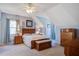 Spacious main bedroom with neutral carpet, fan, and ample natural light from a dormer window at 318 Archibald Dr, Goose Creek, SC 29445