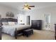 Bright main bedroom featuring a ceiling fan, comfortable furnishings, and an en-suite bathroom at 318 Archibald Dr, Goose Creek, SC 29445