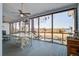 Inviting screened porch with seating area, fan, and scenic views of the surrounding landscape at 318 Archibald Dr, Goose Creek, SC 29445