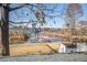 Picturesque water view framed by trees, overlooking a boat dock and the sprawling lake at 318 Archibald Dr, Goose Creek, SC 29445