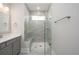 Modern bathroom featuring frameless shower with tile surround, built-in bench and updated vanity at 332 Dahlia Row Dr, Summerville, SC 29486