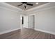 Spacious bedroom featuring wood floors, trey ceiling, and two doors, one leading to the other room at 332 Dahlia Row Dr, Summerville, SC 29486