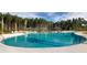 Large community pool and sundeck area with lounge chairs, umbrellas, and a gazebo, great for outdoor relaxation at 332 Dahlia Row Dr, Summerville, SC 29486