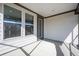Relaxing covered patio featuring a smooth concrete floor, ideal for entertaining guests outdoors at 332 Dahlia Row Dr, Summerville, SC 29486