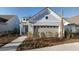 Charming light blue home featuring an attached garage and a beautifully landscaped front yard at 332 Dahlia Row Dr, Summerville, SC 29486