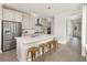 Modern kitchen with a center island, stylish pendant lights, and stainless steel appliances at 332 Dahlia Row Dr, Summerville, SC 29486