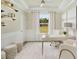 Bright home office with natural light, stylish decor, and a view of the outdoors at 332 Dahlia Row Dr, Summerville, SC 29486