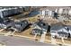 Aerial view of new construction neighborhood featuring quaint cottages with sidewalks and a pond in the background at 3522 Habenaria Rd, Mount Pleasant, SC 29466