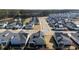 An aerial view of a new home community, showcasing the layout of the neighborhood and surrounding green spaces at 3522 Habenaria Rd, Mount Pleasant, SC 29466