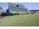 Expansive backyard with lush green lawn, a privacy fence, and an inviting outdoor space for recreation at 3522 Habenaria Rd, Mount Pleasant, SC 29466