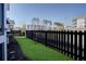 Fenced backyard with green grass and seating area at 3522 Habenaria Rd, Mount Pleasant, SC 29466