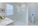 Bathroom featuring glass enclosed shower, marble floors, and white vanity at 3522 Habenaria Rd, Mount Pleasant, SC 29466