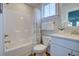 Clean bathroom features a bathtub with shower and neutral color scheme, creating a relaxing and functional space at 3522 Habenaria Rd, Mount Pleasant, SC 29466