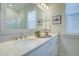 Bright bathroom featuring double vanity with white cabinets, quartz countertop, and a large mirror at 3522 Habenaria Rd, Mount Pleasant, SC 29466