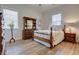 Comfortable bedroom with hardwood floors, a bed, and ample natural light at 3522 Habenaria Rd, Mount Pleasant, SC 29466