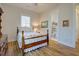 Cozy bedroom with hardwood floors, a bed and bathroom view at 3522 Habenaria Rd, Mount Pleasant, SC 29466